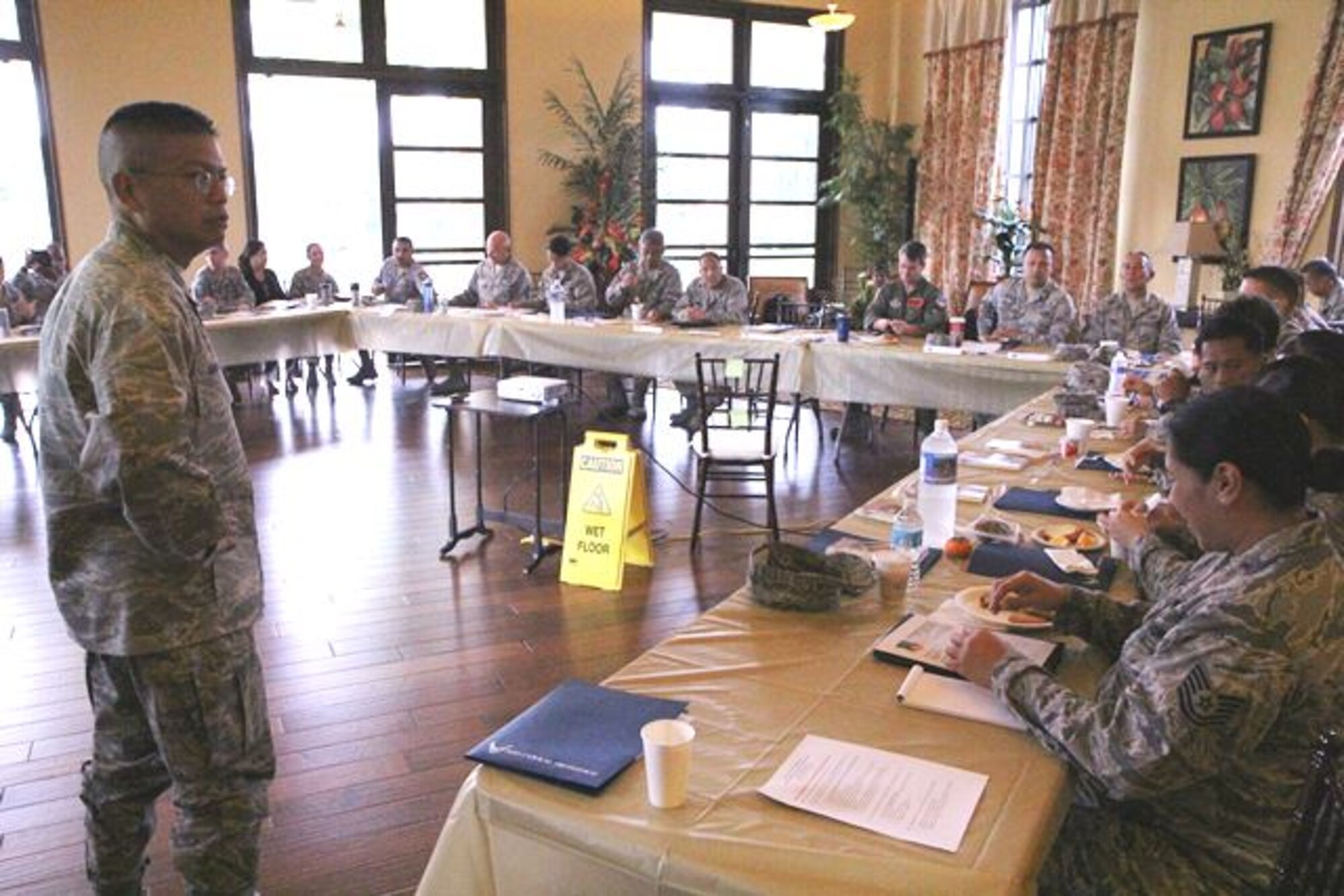 Col. Maynard "Max" Mendoza, left, commander of the 624th Regional Support Group, an Air Force Reserve unit with squadrons based at Joint Base Pearl Harbor-Hickam, Hawaii and Andersen Air Force Base, Guam, prepares to give opening remarks to his staff at the unit's strategic planning session held at the Ka Makani Community Center, Joint Base Pearl Harbor-Hickam, Hawaii, Nov. 21. 2013. Mendoza brought together his staff to develop the Commander's Inspection Program (CIP) and prepare for the unit's Unit Effectiveness Inspection (UEI) slated for November 2015. (U.S. Air Force photo by Tech. Sgt. Phyllis Keith)