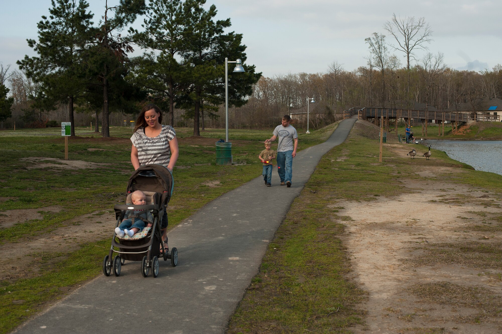 Tech. Sgt. Aaron Drain and his wife, Heather, take their children to the park April, 7, 2013, in Cabot, Ark. Military families are faced with many challenges every time their loved one leaves and deploys to a land of uncertainty. One of those challenges is re-integrating back into family life and a normal routine. (U.S. Air Force photo by Staff Sgt. Russ Scalf)