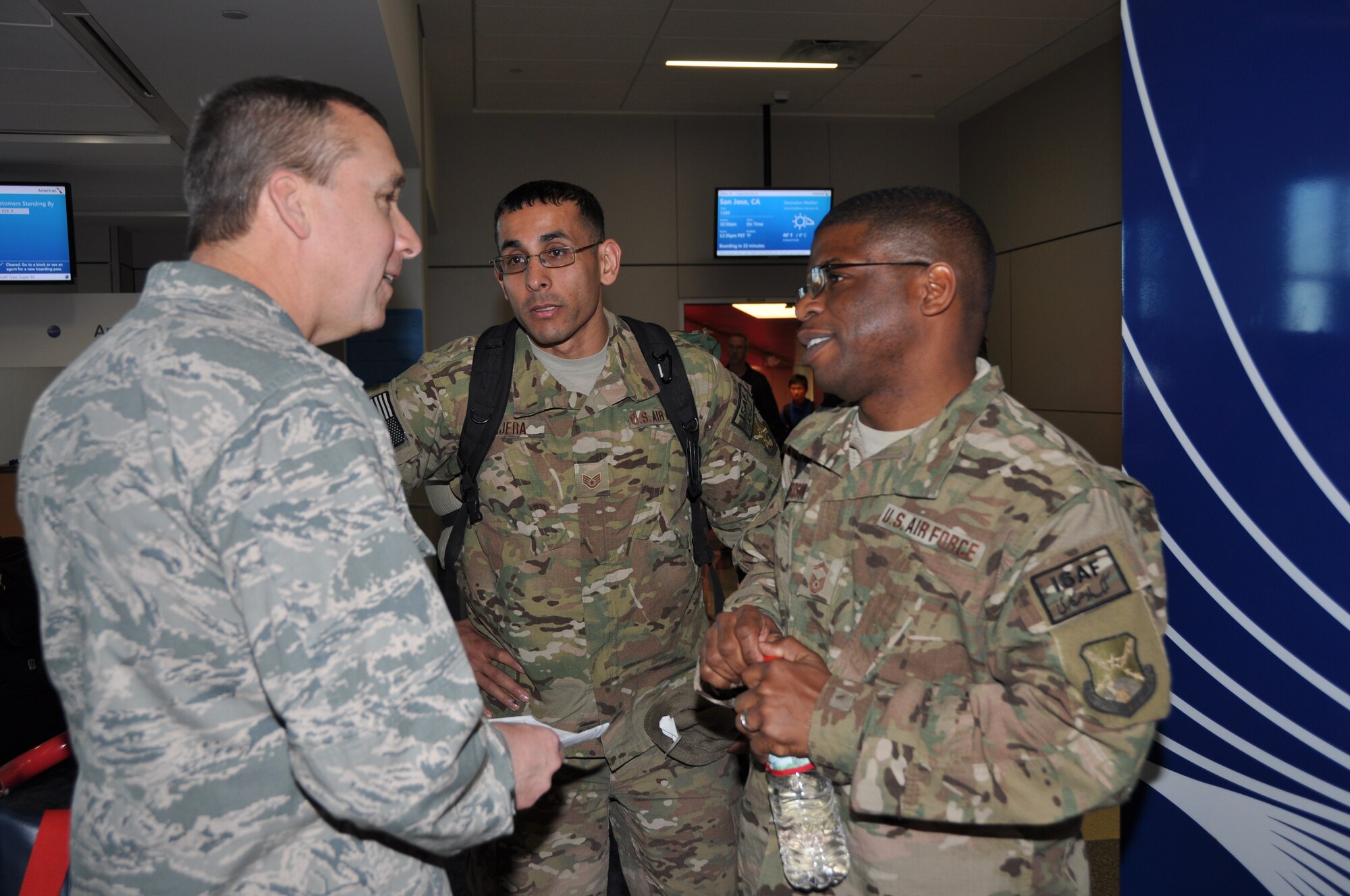 Col. John M. Breazeale, 301st Fighter Wing commander, spent Christmas eve at Dallas-Fort Worth International Airport greeting several of the wing's Airmen returning from a two-month deployment to Afghanistan.  (U.S. Air Force photo/Laura Dermarderosiansmith)