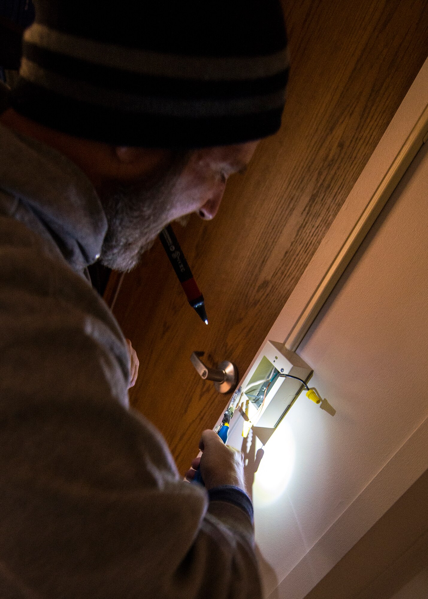 In an effort to save energy contractors install occupancy sensors in offices at the Niagara Falls Air reserve Station, November 26 2013 Niagara Falls, N.Y. These newly installed sensors automatically turn off the lights when a room is left unoccupied for 10 minutes, turning them back on when personnel re-enter. (U.S. Air Force photo by Tech. Sgt. Joseph McKee)