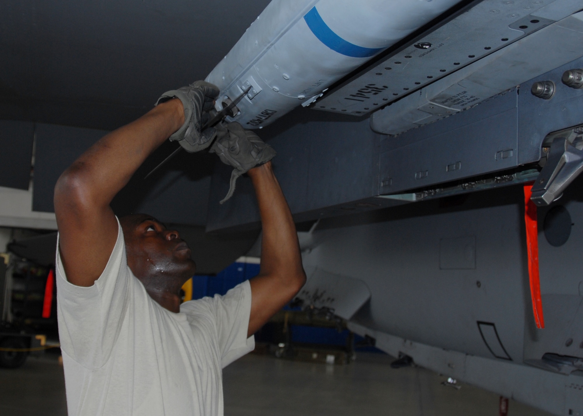 Staff Sgt. Damon Clark of the 96th Aircraft Maintenance Squadron Red, installs wings on an AIM-120 during the 96th Maintenance Group’s quarterly weapons loadcrew competition Dec. 20 at Eglin Air Force Base, Fla.  Clark, Senior Airmen Horace Brown and Kortni Brewer represented the Red AMU.  AMU Blue won the competition. (U.S. Air Force photo/Kevin Gaddie)