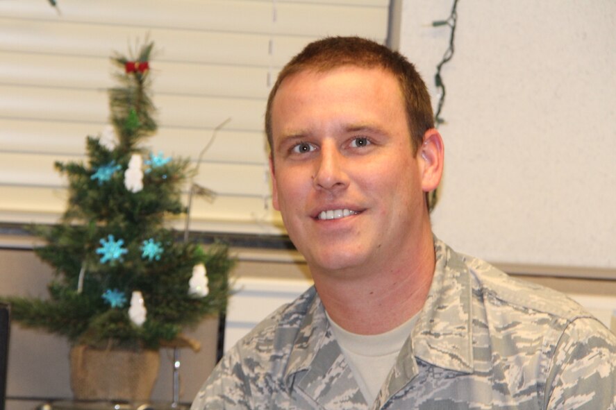 Senior Airman Greg Tuholske, a customer service  technician with the 932nd Airlift Wing Force Support Squadron, says his New Year's Resolution for 2014 is to volunteer more in his community. The 932nd Airlift Wing is a proud partner in many volunteer projects throughout the year including blood donations and patriotic parades.  (Air Force photo by Staff Sgt. Meiko Schill.)