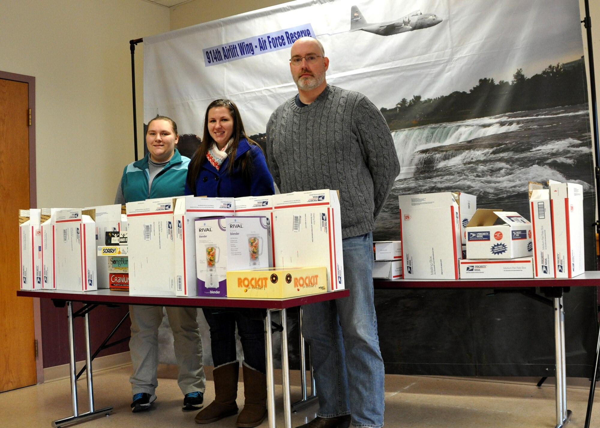 Two Keuka College N.Y. seniors and their advisor visited the Niagara Falls Air Reserve Station on December 6, 2013 and brought with them 30 postage paid care packages to be delivered to deployed Airmen of the 914th Airlift Wing.  Part of a larger communication practice class, these students were the first bachelor's level class to successfully complete this outreach project.  L to R:  Brittany Emerson, Brittni Fuller and Professor Kevin Murphy.  Missing from photo:  Taylor Wade, Arielle Colton, Casey Chamberlin, Olivia Balistreri.  (U.S. Air Force photo by Master Sgt. Kevin Nichols)