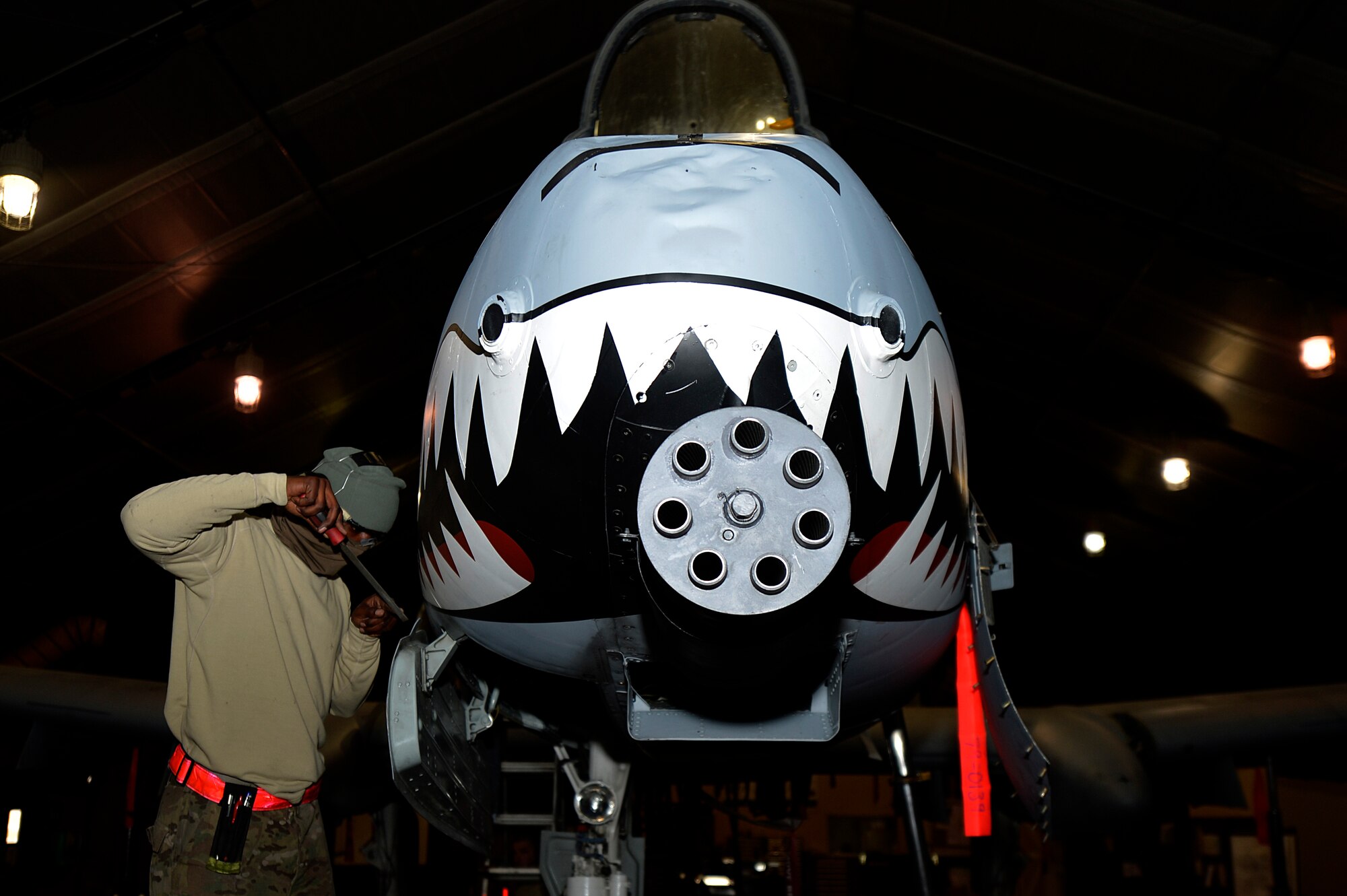 U.S. Air Force Senior Airman Craig Irvine, 455th Expeditionary Maintenance Squadron A-10 Thunderbolt II sheet metal technician, grinds down metal on an A-10 Thunderbolt II at Bagram Airfield, Afghanistan, Dec. 30, 2013. The A-10 Thunderbolt II provides close-air support for troops on the ground. Irvine is deployed from the 23rd Equipment Maintenance Squadron at Moody Air Force Base, Ga., and is a native of Lake Charles, La. (U.S. Air Force photo by Senior Airman Kayla Newman/Released)