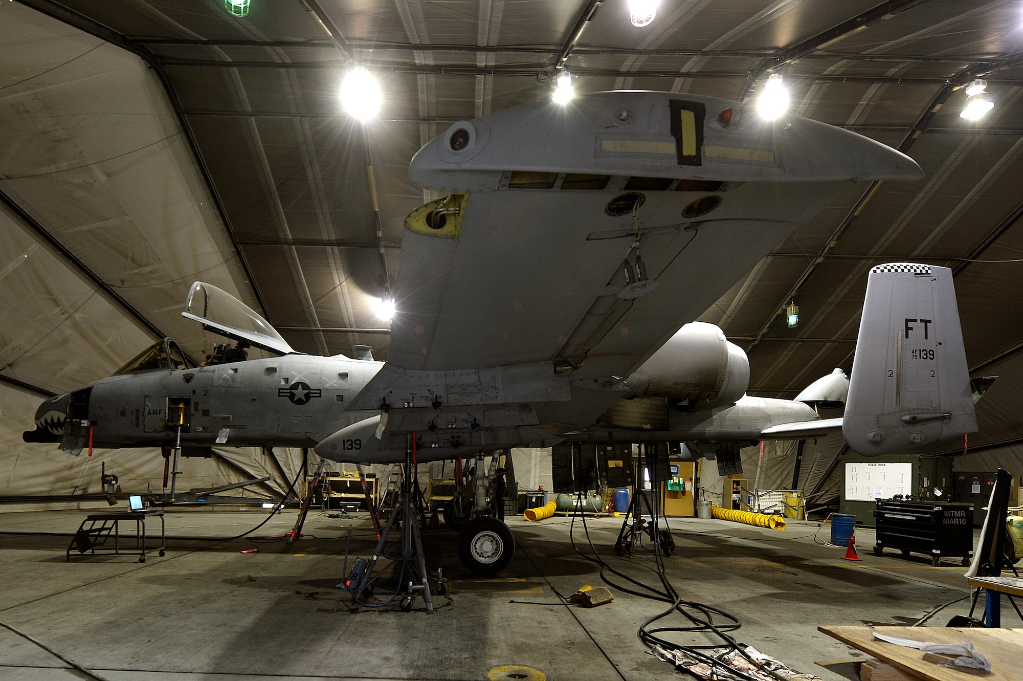 An A-10 Thunderbolt II receives scheduled maintenance at at Bagram Airfield, Afghanistan, Dec. 30, 2013. The A-10 Thunderbolt II has a wide combat radius and short takeoff and landing capabilities, as well as being able to provide close-air support for troops on the ground. (U.S. Air Force photo by Senior Airman Kayla Newman/Released)