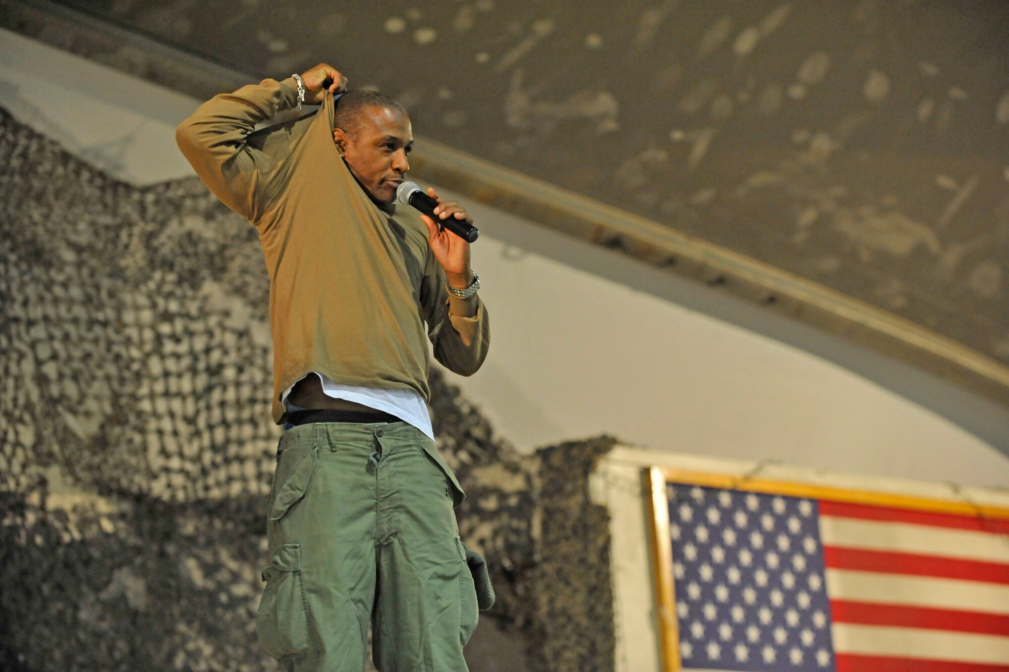 Comedian Tommy Davidson performs his comedy show for deployed Service members on New Year's Eve at Bagram Airfield, Afghanistan, Dec. 31, 2013.(U.S. Air Force photo by Senior Master Sgt. Gary J. Rihn/Released)