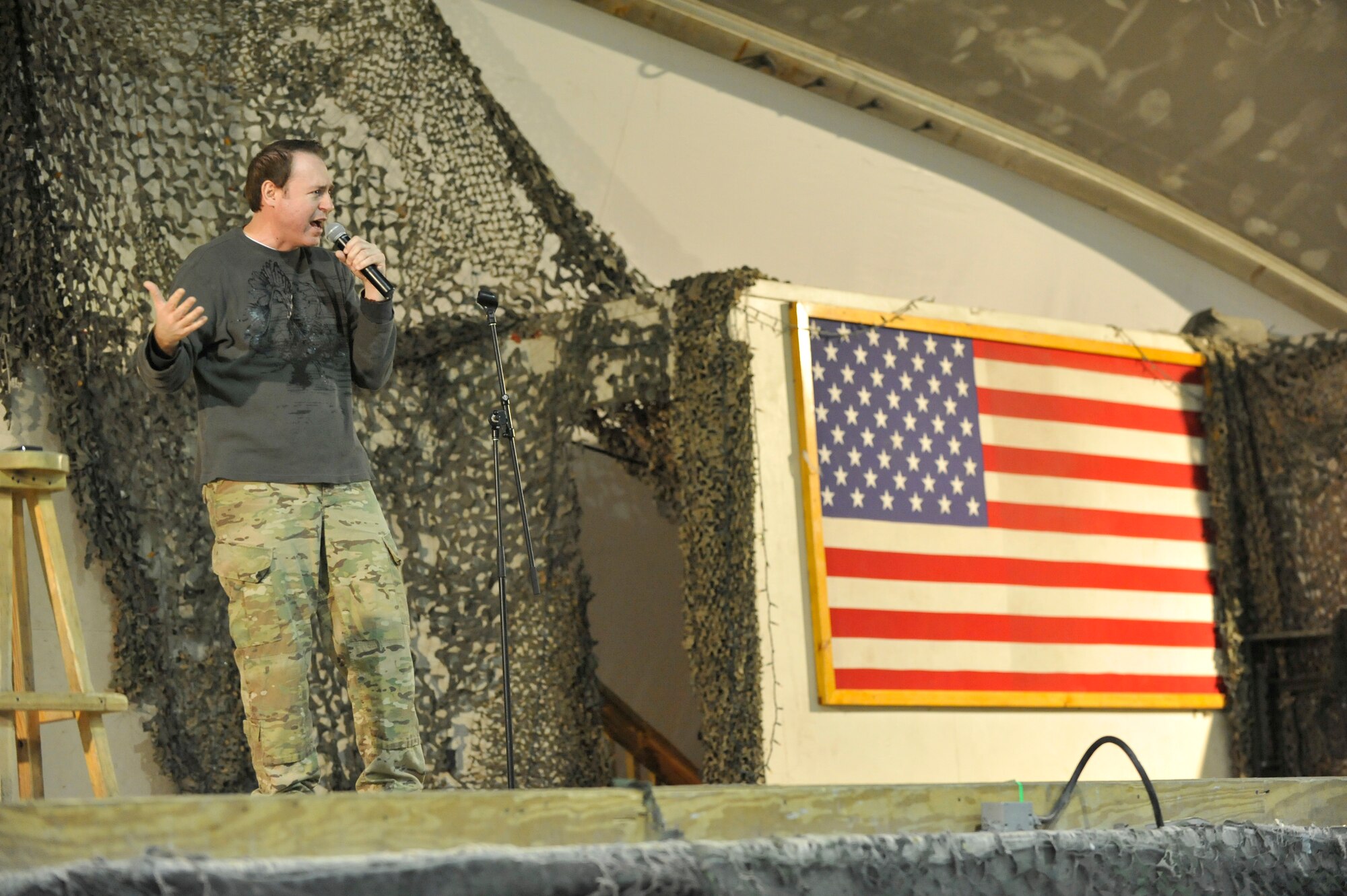 Comedian Rob Maher performs for deployed Service members on New Year's Eve at Bagram Airfield, Afghanistan, Dec. 31, 2013. Maher was touring with fellow comedian Tommy Davidson.(U.S. Air Force photo by Senior Master Sgt. Gary J. Rihn/Released)