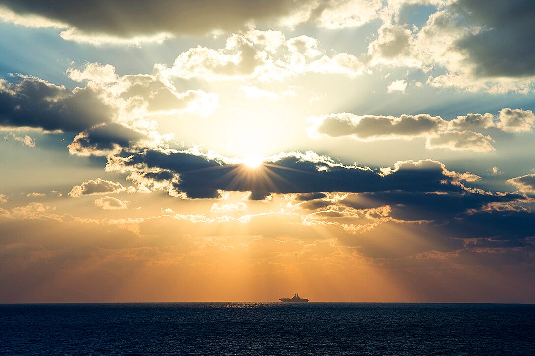 The amphibious assault ship USS Boxer is shown underway in the Arabian Gulf, Dec. 23, 2013. The Boxer is the flagship for the Boxer Amphibious Ready Group, which supports maritime security operations and theater security cooperation efforts in the U.S. 5th Fleet area of responsibility.