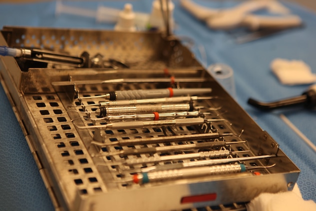 Tools used in dentistry lay on a table for use during an exam in the Marine Corps Recruit Depot Parris Island Dental Clinic, Jan. 24. Preparing tools for dentists to use is part of a list of tasks that Dental assistants graduating from the American Red Cross Dental Assisting Program will carry out on a daily basis.