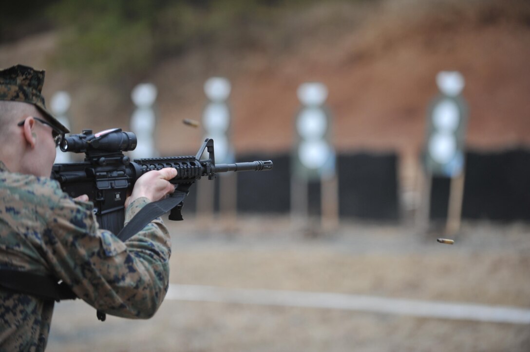 Pfc. Adam Gozelanczyk, infantryman, takes a few well aimed shots with his M4 Carbine during a training exercise on the High Risk Personnel Course at Weapons Training Battalion on Jan. 30. There were five different phases that the Marines had to go through during the exercise. 