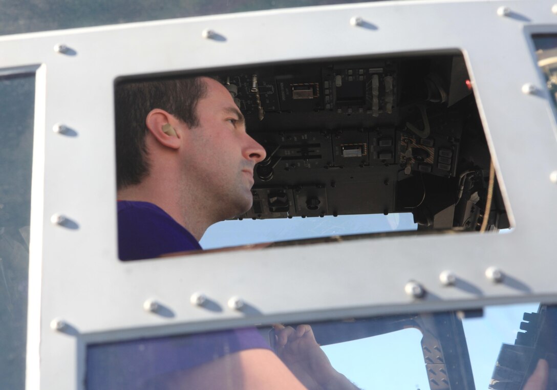 Devin Johnson, a math teacher with Hallsville High School and a Lincoln, Mo., native, sits in the cockpit of an MV-22B Osprey during an Educators Workshop aboard Marine Corps Air Station Miramar, Calif., Jan. 30. Educators learned about the different aircraft and their capabilities aboard the air station.    