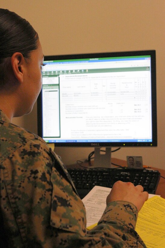 Pfc. Vania Diaz, a volunteer tax preparer with the tax center, prepares a 1040 form during a private opening of the tax center aboard Marine Corps Air Station Miramar, Calif., Jan. 30. All volunteers use the professional tax software, TaxWise, to guarantee an accurate electronic file.


