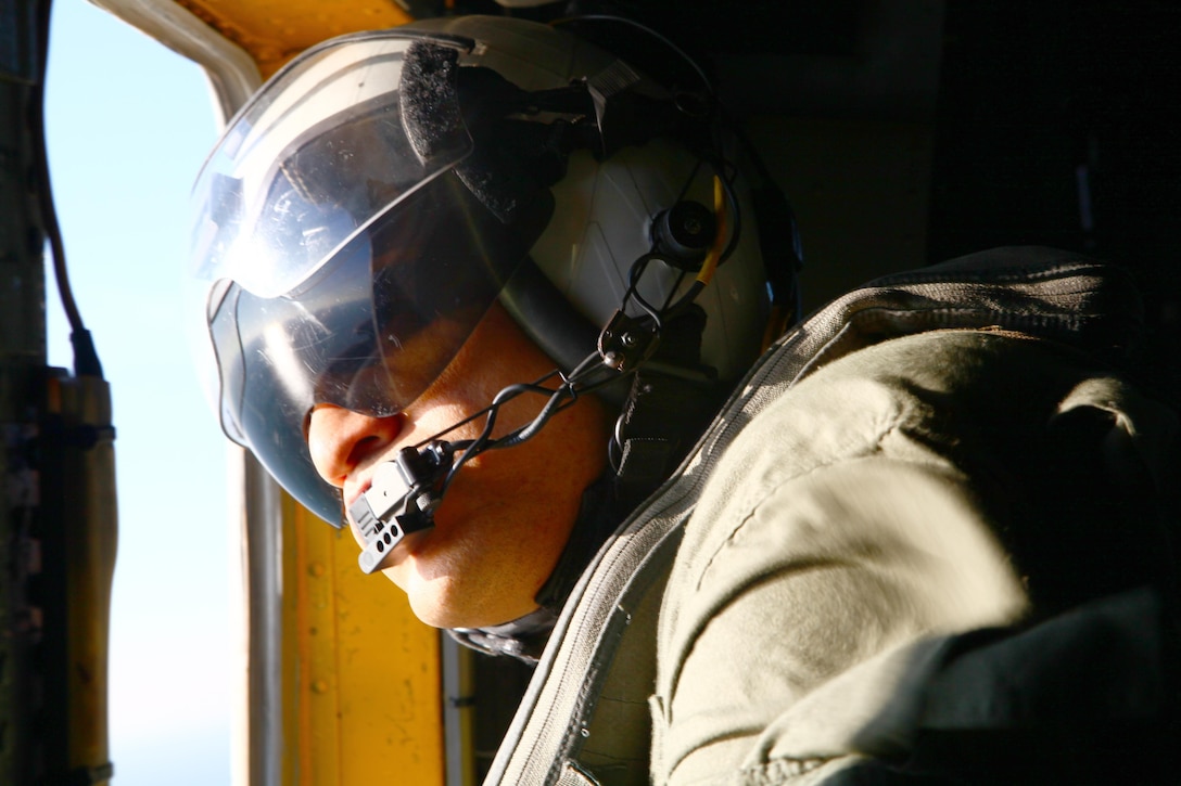 Cpl. Lanes Venus, an intelligence analyst and aerial observer-in-training with Marine Heavy Helicopter Squadron 465 'Warhorse,' 3rd Marine Aircraft Wing and a New York native, stares off into the vast, blue ocean before performing helocasting training near Marine Corps Base Camp Pendleton, Calif., Jan. 31. During the training, crew chiefs must quickly accustom themselves to working as a team with jumpers, or the mission could fail.