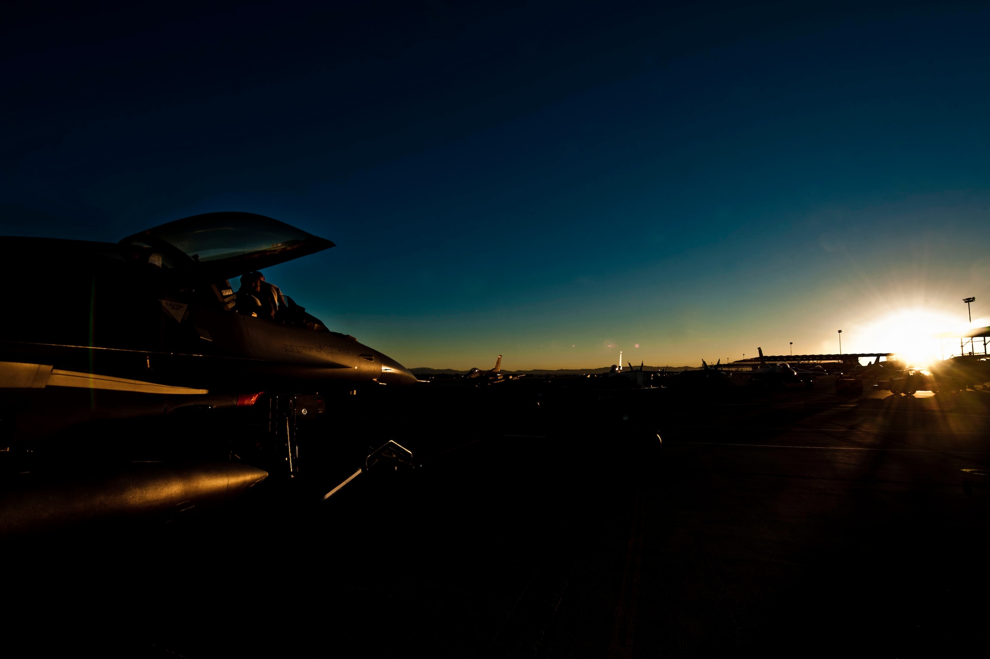 Airmen from the 480th Fighter Squadron from the 52nd Fighter Wing out of Spangdahlem Air Base, Germany, work on a F-16 Fighting Falcon during Red Flag 13-2 Jan. 30, 2013, at Nellis Air Force Base, Nev. The 480th FS received a manning assist of about 50 Airmen from the 555th FS from the 31st Fighter Squadron out of Aviano Air Base, Italy.  The unit participated in both Red and Green Flag exercises. (U.S. Air Force photo by Senior Airman Daniel Hughes)