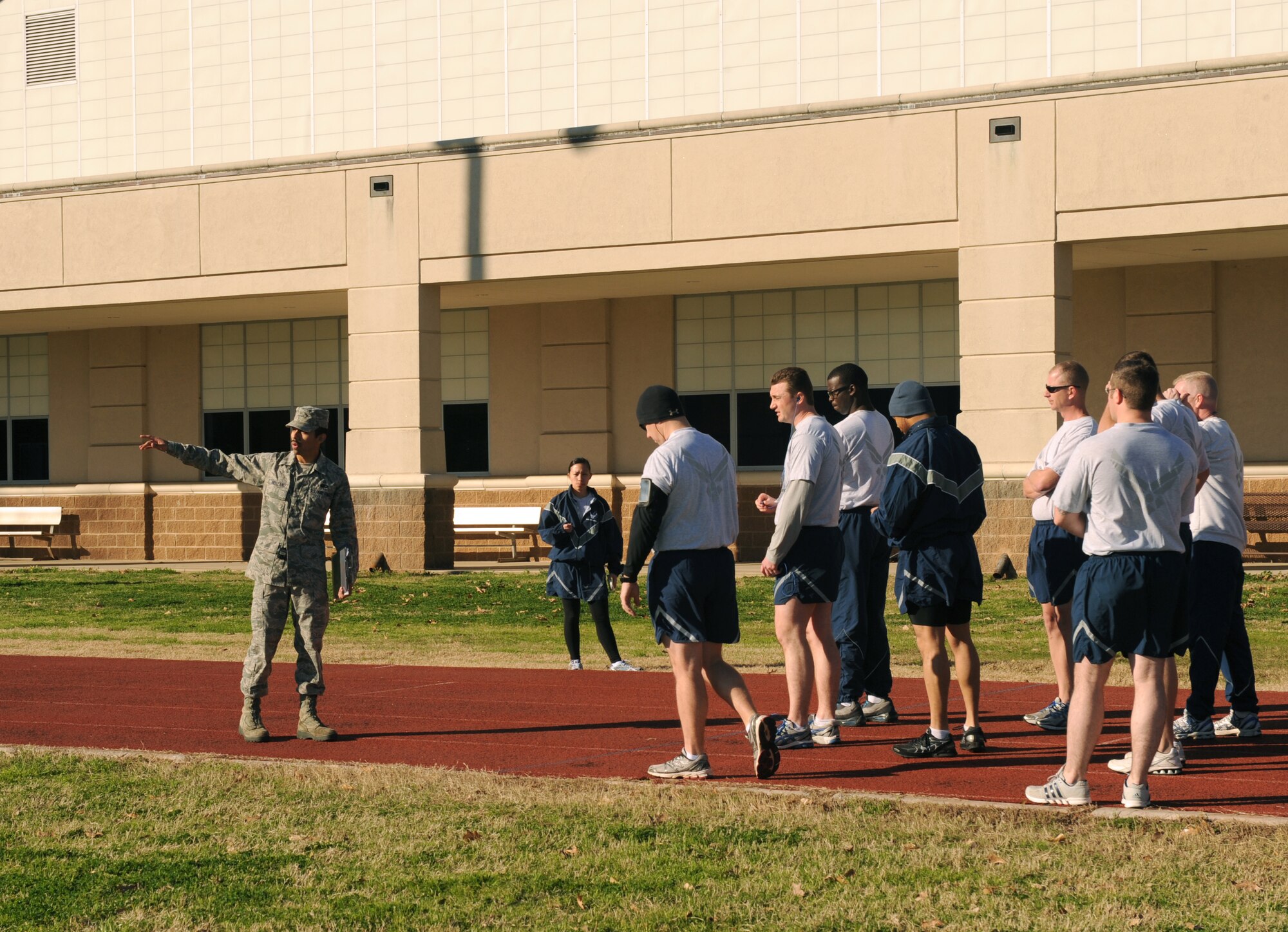 Senior Airman Braulio Arellano, 2nd Force Support Squadron fitness specialist, gives instructions to Airmen before they take their physical training test on Barksdale Air Force Base, La., Feb. 1. Fitness specialists clean equipment, administer PT tests and build fitness programs for base personnel. (U.S. Air Force photo/Airman 1st Class Benjamin Gonsier)