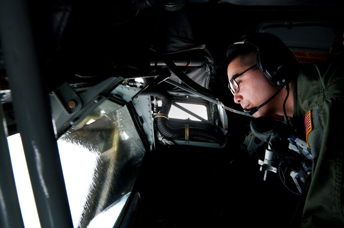 Tech. Sgt. Geoff Schulz, 64th Air Refueling Squadron boom operator on a KC-135 Stratotanker, from the 22nd Air Refueling Wing out of McConnell Air Force Base, Kansas, refuels jets during Red Flag 13-2 Jan. 25, 2013, above the Nevada Test and Training Range. The refueling procedure allows the receiving aircraft to remain airborne longer and extends its range. Red Flag’s mission is to maximize the combat readiness and survivability of participants by providing a realistic training environment and forum that encourages a free exchange of ideas. (U.S. Air Force Photo by Airman 1st Class Jason Couillard)