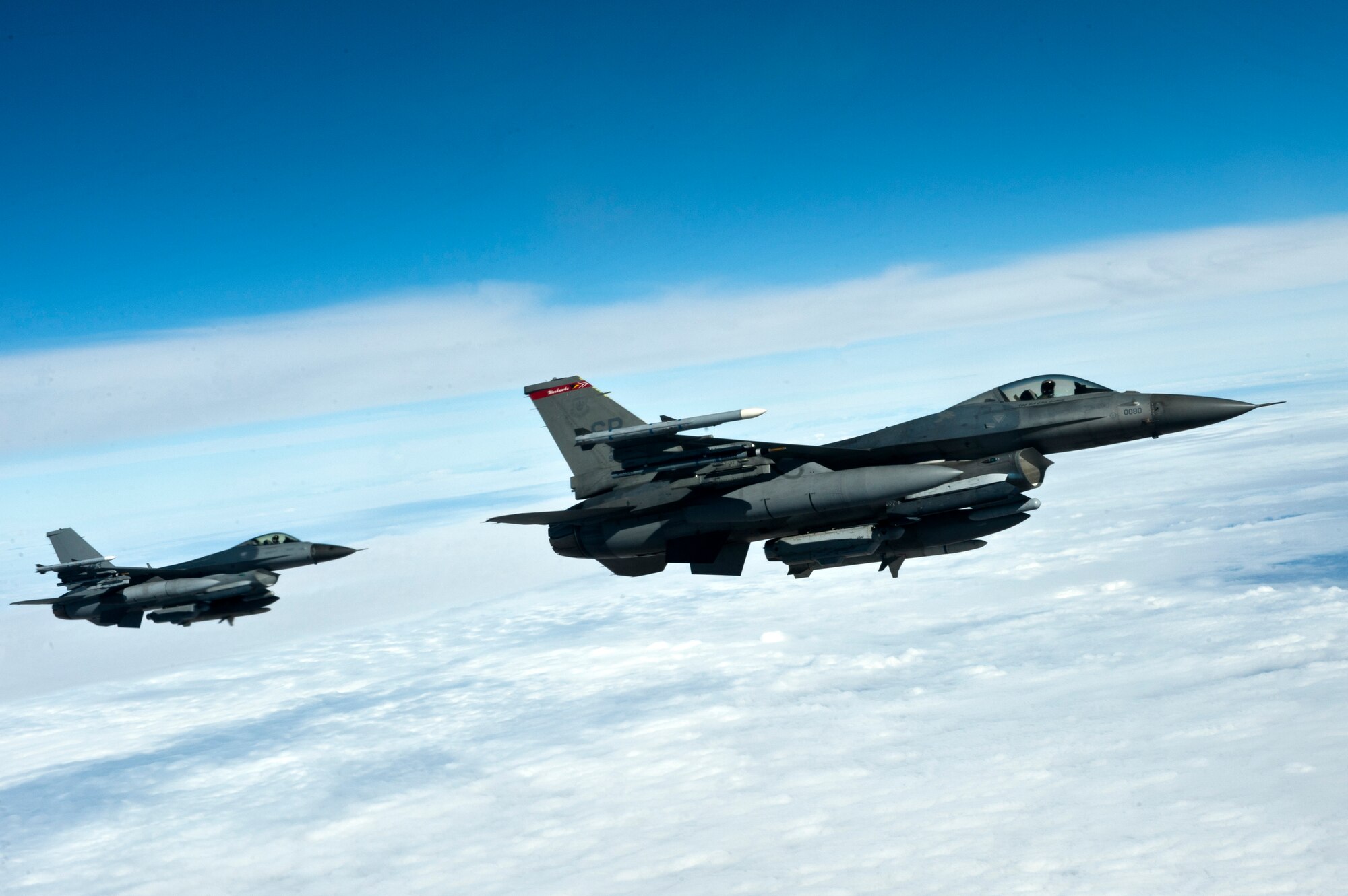 Two F-16 Fighting Falcons from the 480th Fighter Squadron from the 52nd Fighter Wing Spangdahlem Air Base, Germany, prepare to refuel during Red Flag 13-2 above the Nevada Test and Training Range Jan. 25, 2013. Each Red Flag exercise normally involves a variety of fighter interdiction, attack, air superiority, defense suppression, airlift, air refueling, and reconnaissance missions for Airmen to mission plan and execute. (U.S. Air Force Photo by Airman 1st Class Jason Couillard)
