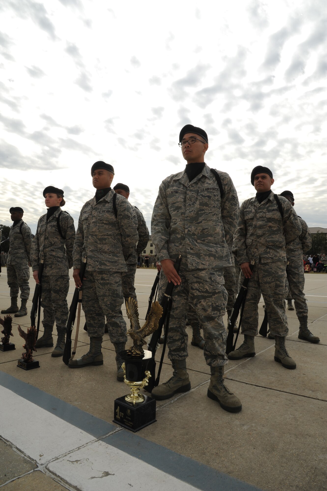 Members of the 338th Training Squadron drill down competition team stand in formation in front of the trophies they accumulated during the first drill down of the season Feb. 1, 2013, at the Levitow Training Support Facility, Keesler Air Force Base, Miss.  The 338th TRS was the overall winner of the drill down, with the 335th TRS taking second and the 336th TRS in third.  (U.S. Air Force photo by Kemberly Groue)