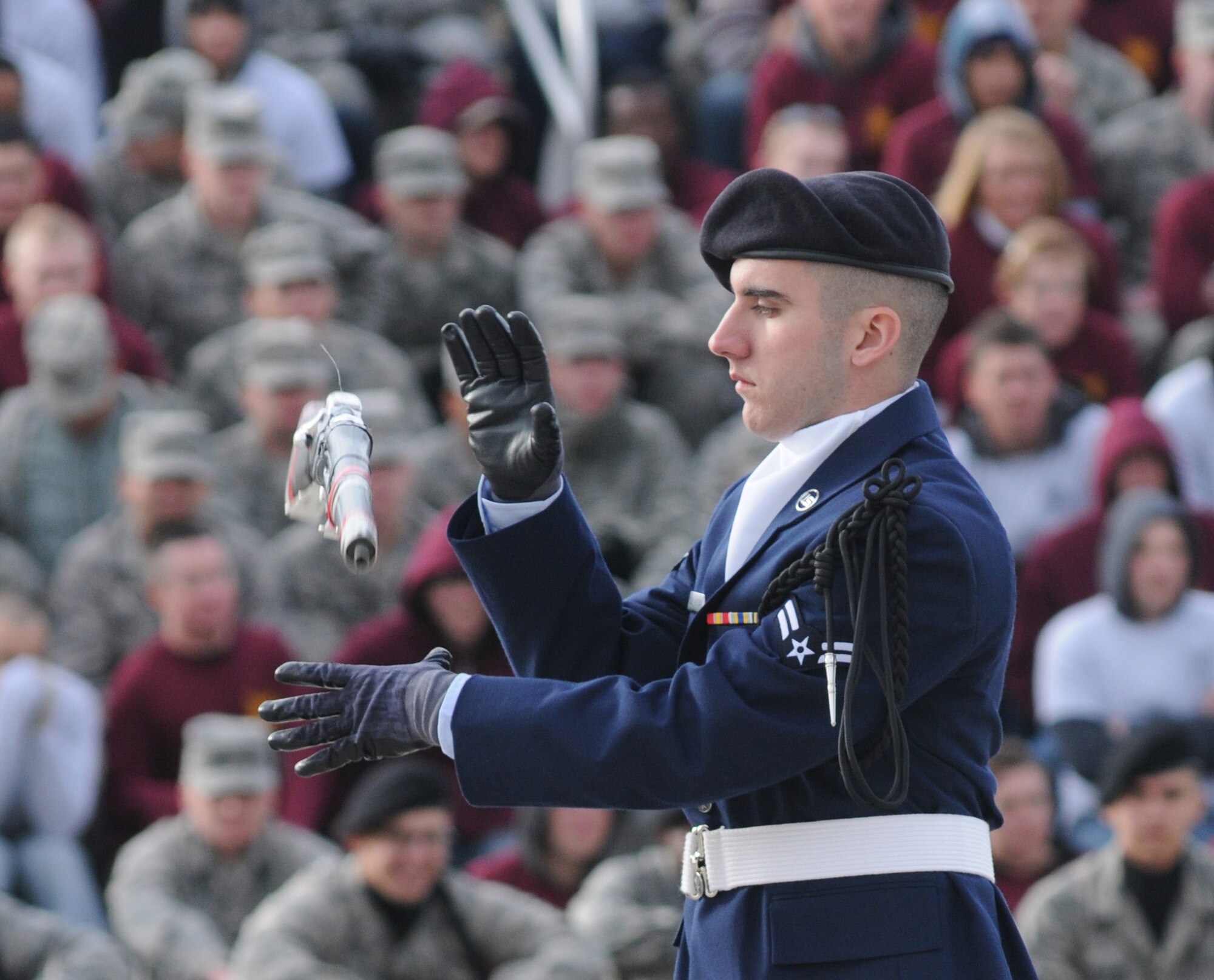 Airman 1st Class Joseph Day-Bottai, 335th Training Squadron, spins his weapon during the freestyle drill competition at the first drill down of the season Feb. 1, 2013, at the Levitow Training Support Facility, Keesler Air Force Base, Miss.  The 338th TRS was the overall winner of the drill down, with the 335th TRS taking second and the 336th TRS in third.  (U.S. Air Force photo by Kemberly Groue)