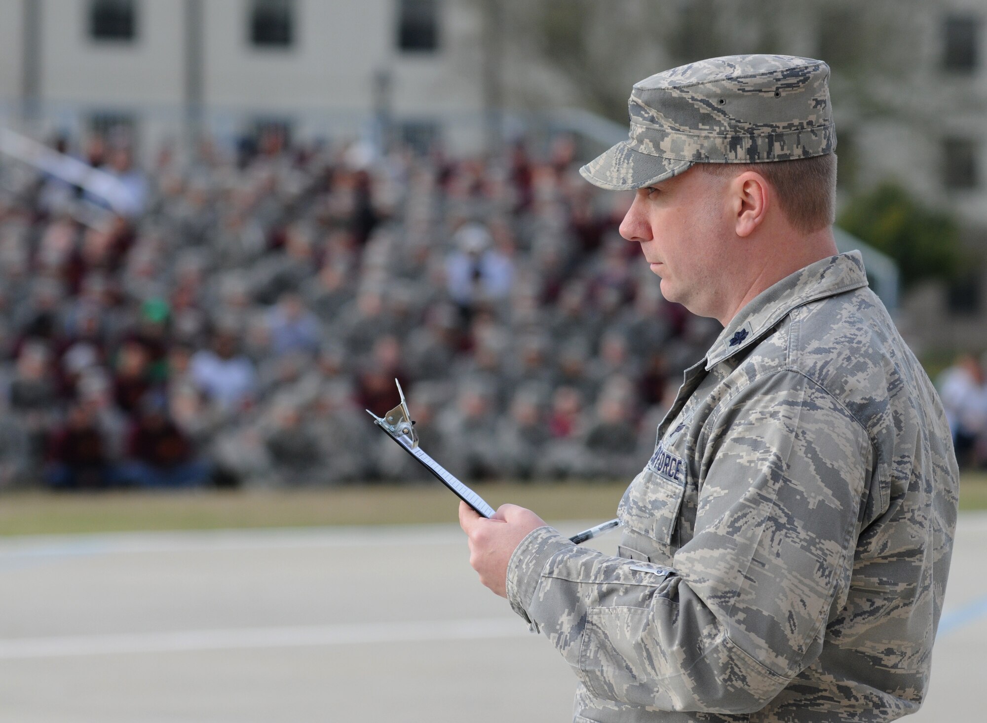 Lt. Col. Bradley McAlpine, 335th Training Squadron commander, judges competitors at the first drill down of the season Feb. 1, 2013, at the Levitow Training Support Facility, Keesler Air Force Base, Miss.  The 338th TRS was the overall winner of the drill down, with the 335th TRS taking second and the 336th TRS in third.  (U.S. Air Force photo by Kemberly Groue)