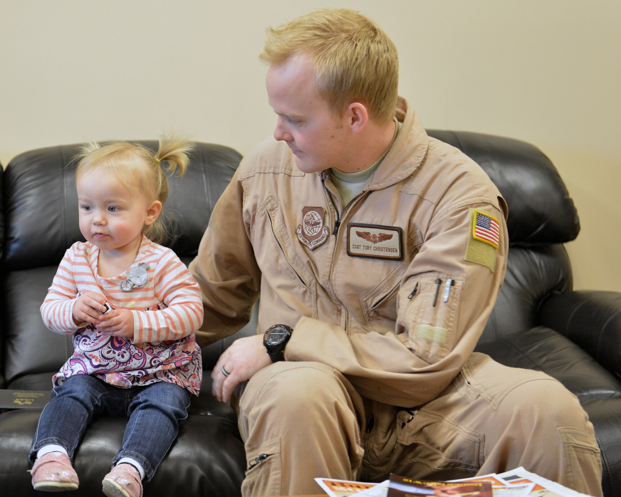 Staff Sgt. Toby Christensen, 8th Airlift Squadron loadmaster, plays with his daughter, Meika, before leaving for a 60-day deployment to Southwest Asia, Jan. 31, 2013, at Joint Base Lewis-McChord, Wash. The 8th AS will take over operations of the 817th Expeditionary Airlift Squadron. (U.S. Air Force photo/Staff Sgt. Jason Truskowski)
