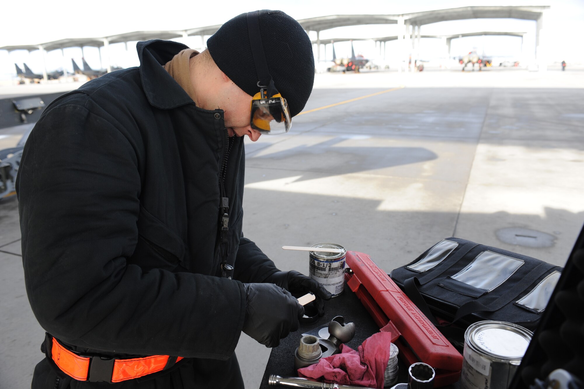 U.S. Air Force Staff Sgt. Brett Tyler, 366th Aircraft Maintenance Squadron weapons load crew team chief for the Bold Tigers, mixes sealing compound for a pylon sway brace post Jan. 30, 2013, at Mountain Home Air Force Base, Idaho. Inspectors from Air Combat Command spent the week evaluating the multiple tasks performed by flightline personnel. (U.S. Air Force photo/Senior Airman Benjamin Sutton)