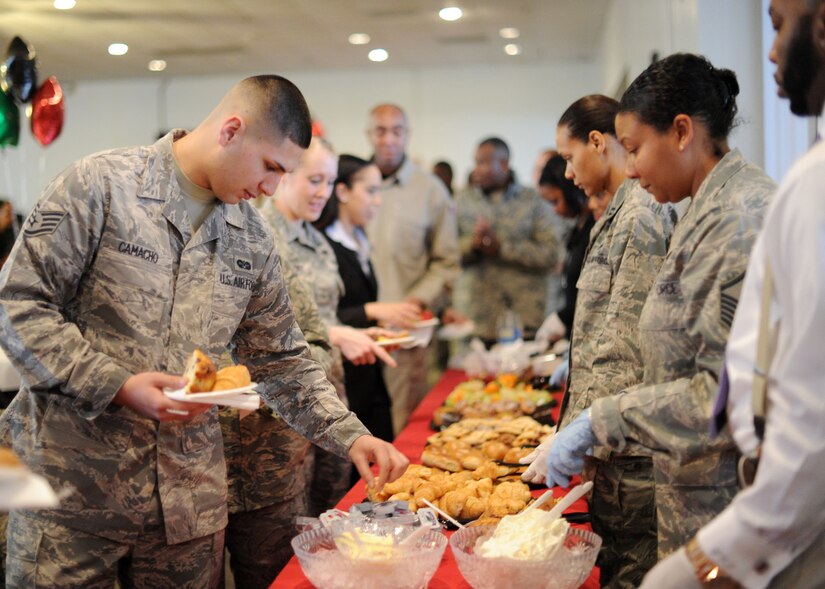 Team Andrews' members select food items during the Black History Month Opening Breakfast at Joint Base Andrews, Md., Feb. 1, 2013. The event hosted by the 459th Air Refueling Wing featured guest speaker Dr. Roscoe C. Brown Jr., who was a former Tuskegee Airman. (U.S. Air Force photo/ Staff Sgt. Nichelle Anderson) 
