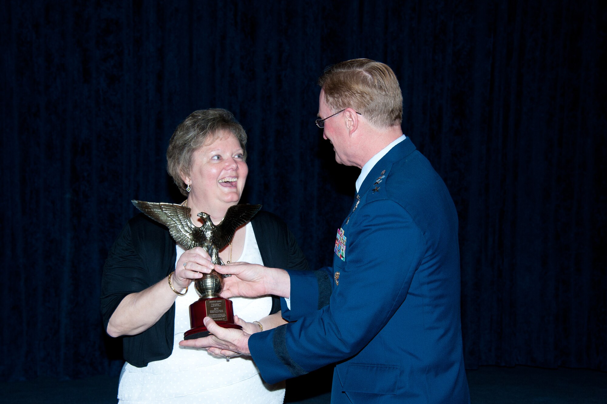Debbie Gaddy, chair of the Alabama Goodwill Ambassadors' Advisory Committee, was selected from more than 85,000 individuals across 12 Air Education and Training Command bases to receive the inaugural AETC International Student Support Award, presented by Lt. Gen. David Fadok, Air University commander and president, Tuesday during a ceremony at the Maxwell Club. (U.S. Air Force photo by Melanie Rodgers Cox)

