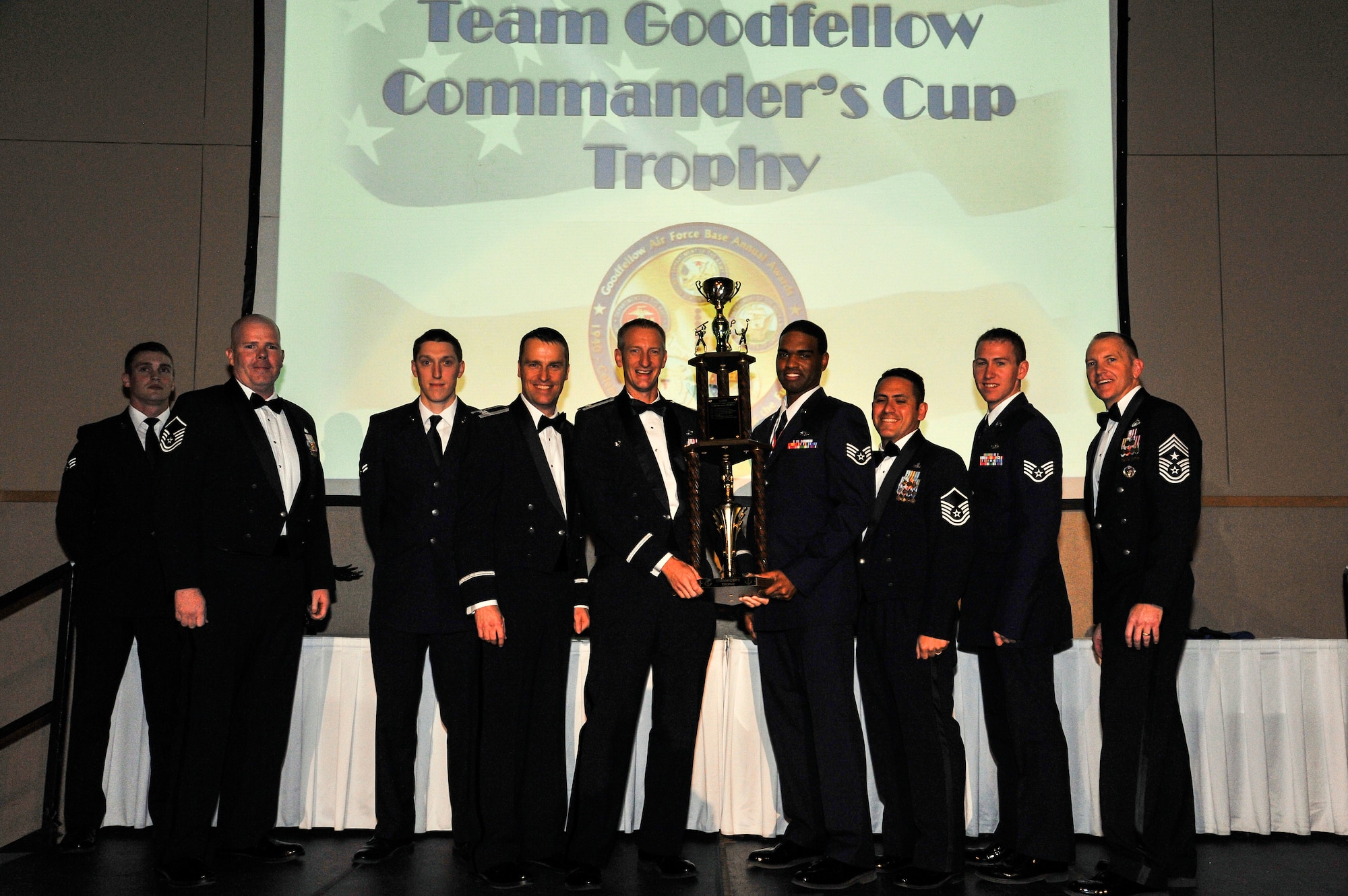 SAN ANGELO, Texas -- Lt. Col. Keith Logeman, 17th Training Support Squadron Commander, and members of the 17th TRSS accepts the 17th Training Wing 2012 Commanders’ Cup on behalf of the 17th TRSS from Col. Thomas Schmidt, 17th TRW vice commander, and Chief Master Sgt. Scott Lumpkin, 17th TRW Command Chief. The annual awards program recognizes military and civilian personnel who compete in 20 categories for their significant contributions to the 17th TRW, the community and the mission. (U.S. Air Force photo/Airman 1st Class Michael Smith) 