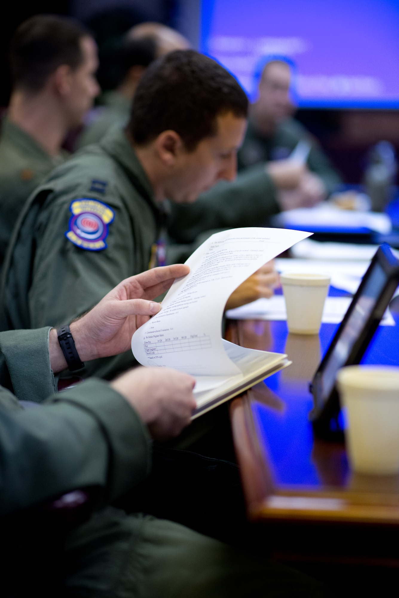 Pilots from the 60th Operations Group reference notes and records while being interviewed by Air Mobility Command's command evaluator during this week's Aircrew Standardization and Evaluation Visit. (U.S. Air Force Photo/Ken Wright)