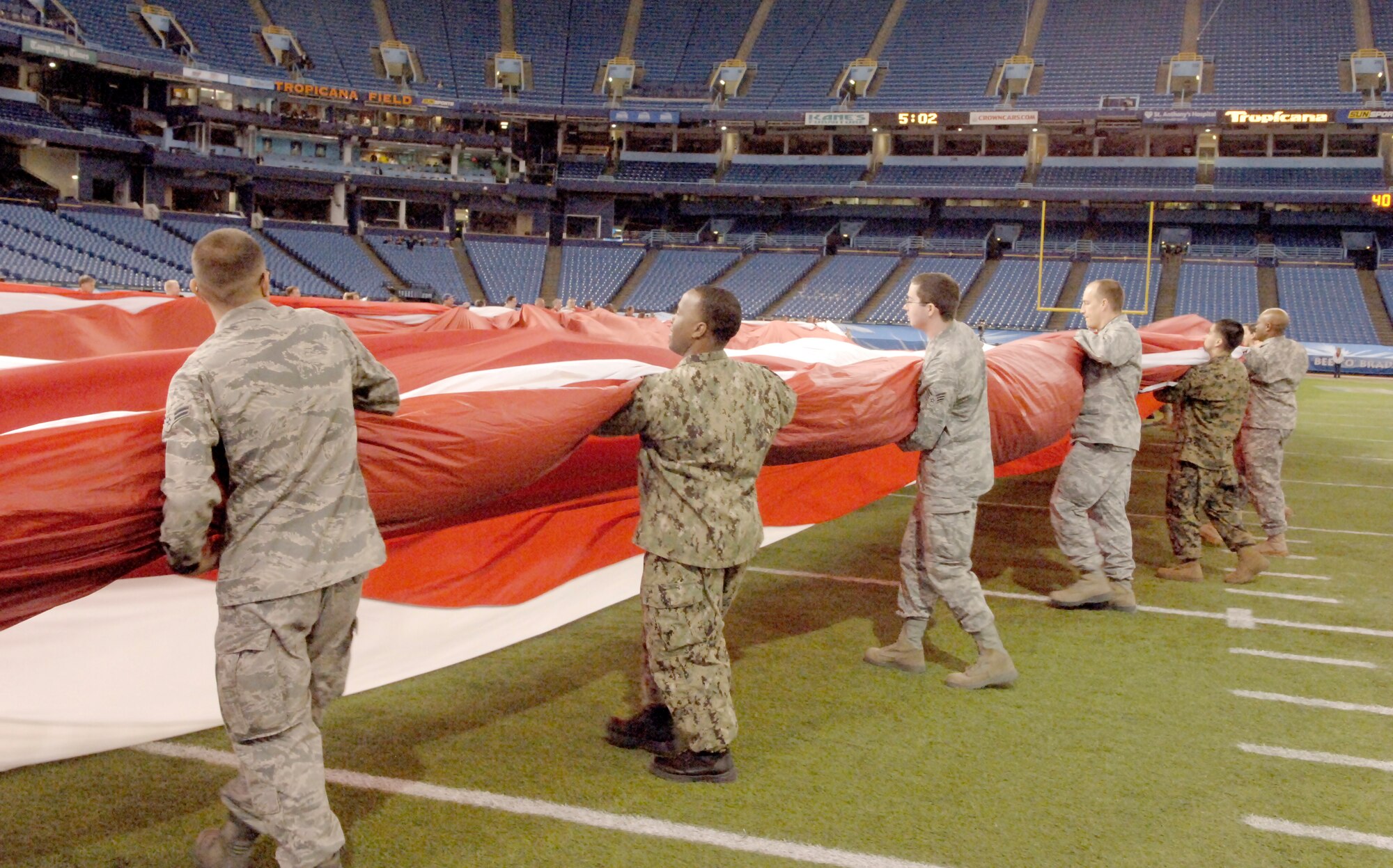 ST PETERSBURG, Fla. – Military members from nearby MacDill Air Force Base practiced unfurling a huge American flag prior to the game.  Approximately 150 servicemembers and their families volunteered to properly unfurl the flag on the field.  (Official U.S. Air Force photo/Staff Sgt. Rachelle Coleman)