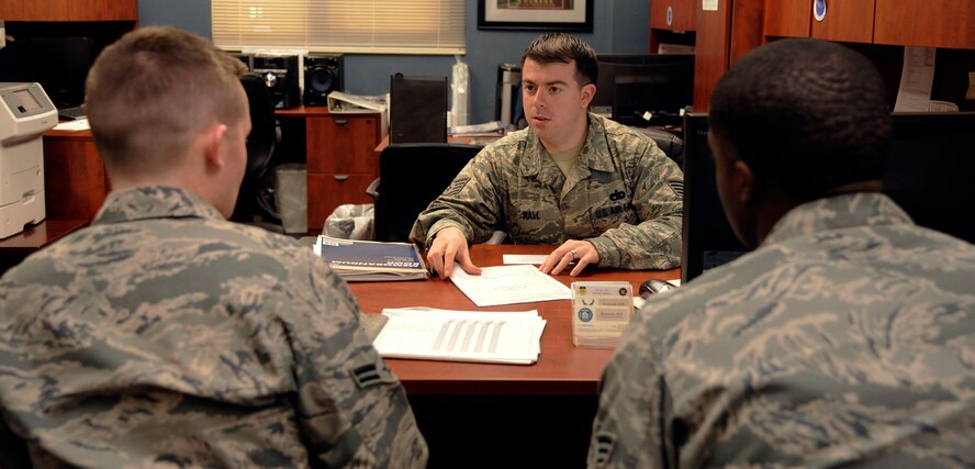 Staff Sgt. Christopher Wall, 2nd Civil Engineer Squadron Airman Dormitory Leader, briefs a new Airman on dormitory rules on Barksdale Air Force Base, La., Jan. 31. Wall's duties as an Airman Dormitory Leader include assigning rooms, briefings, and repairs and maintenance to dormitory facilities. (U.S. Air Force photo/Airman 1st Class Andrew Moua)