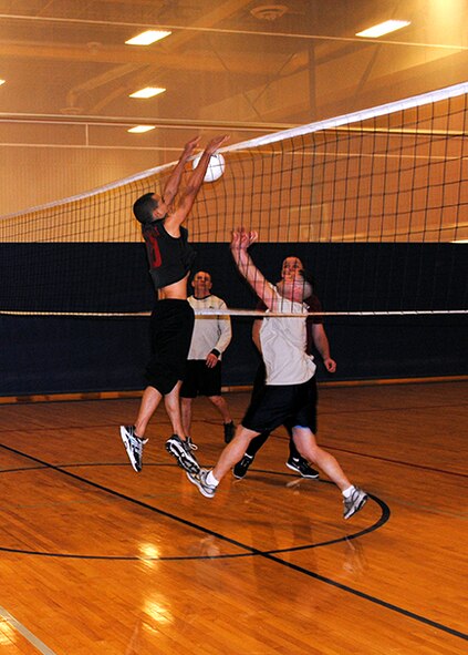Teams face off during a game of volleyball at Wing Sports Smackdown on Jan. 25 at the fitness center. After several events, including ping pong, foosball, broom hockey, mini golf, dance central, basketball, cornhole, volleyball, dodgeball, and soccer, the 341st Security Forces Group walked away with the coveted trophy. (U.S. Air Force photo/Senior Airman Cortney Paxton)