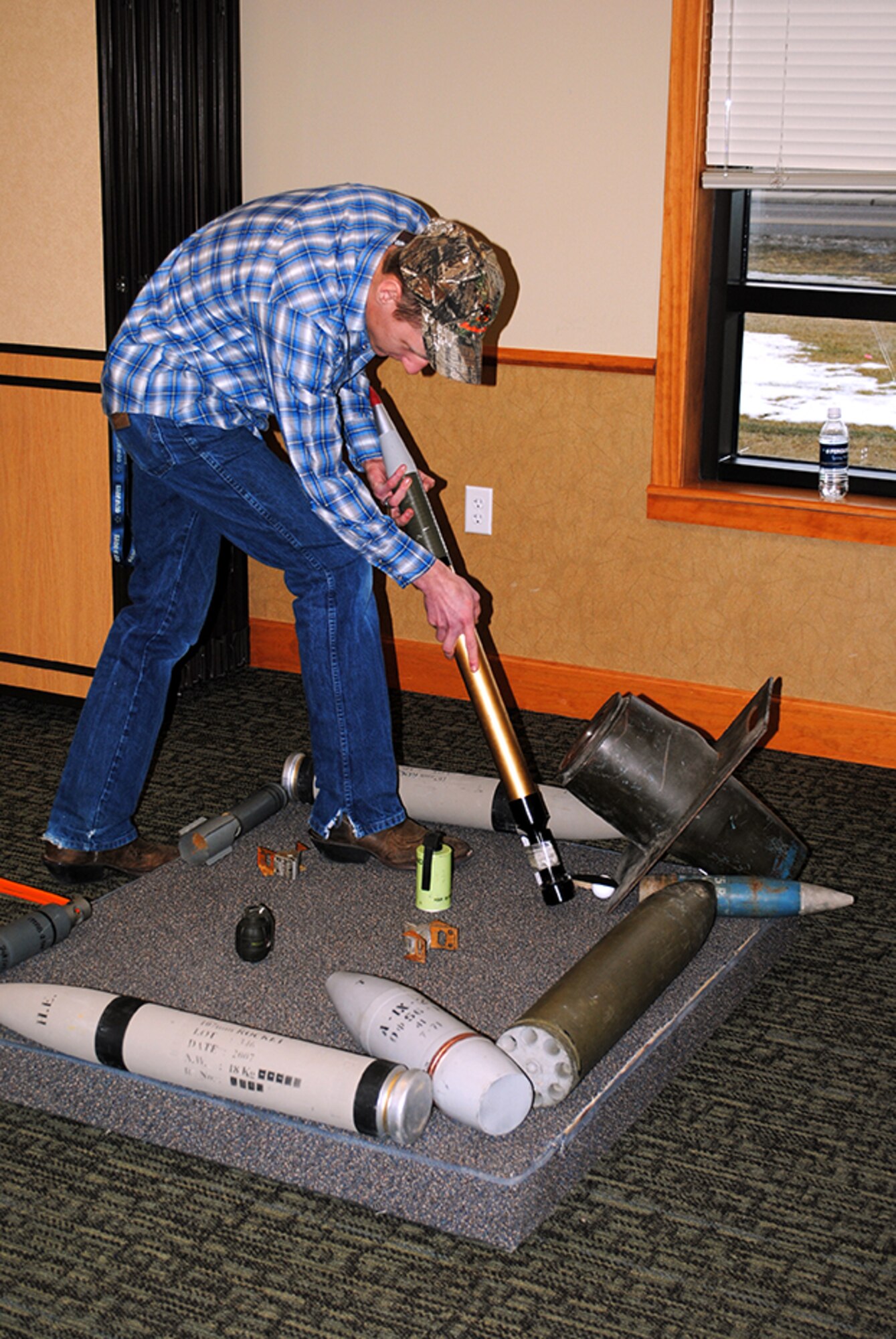 Senior Airman Terry Butterfield, 341st Mission Support Group knowledge operator, lines up his shot during a round of mini golf at Wing Sports Smackdown on Jan. 25 at the Grizzly Bend. Until the next Wing Sports Smackdown, scheduled for April 26, winning squadron 341st Security Forces Group will hold the trophy and newly earned bragging rights. (U.S. Air Force photo/Senior Airman Cortney Paxton)