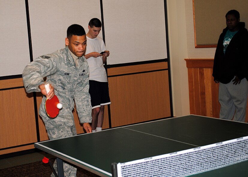 against Senior Airman Jordan Speights (not pictured), 341st Missile Security Forces Squadron member, during a game of ping pong at the Wing Sports Smackdown on Jan. 25 at the Grizzly Bend. After several events, including ping pong, foosball, broom hockey, mini golf, dance central, basketball, cornhole, volleyball, dodgeball, and soccer, the 341st SFG walked away with the coveted trophy. (U.S. Air Force photo/Senior Airman Cortney Paxton)