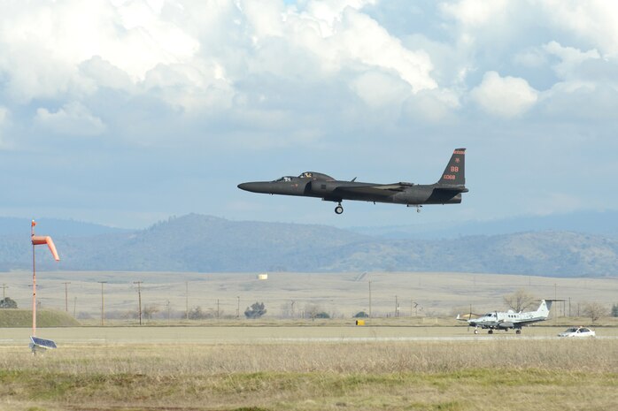 A U.S. Air Force U-2 Dragon Lady lands after flying a training sortie as a MC-12 Liberty aircraft waits for takeoff at Beale Air Force Base, Calif., Jan. 25, 2013. Sorties consist of flying patterns and running through touch and go exercises. (U.S. Air Force Photo by Mr. John Schwab/Released)