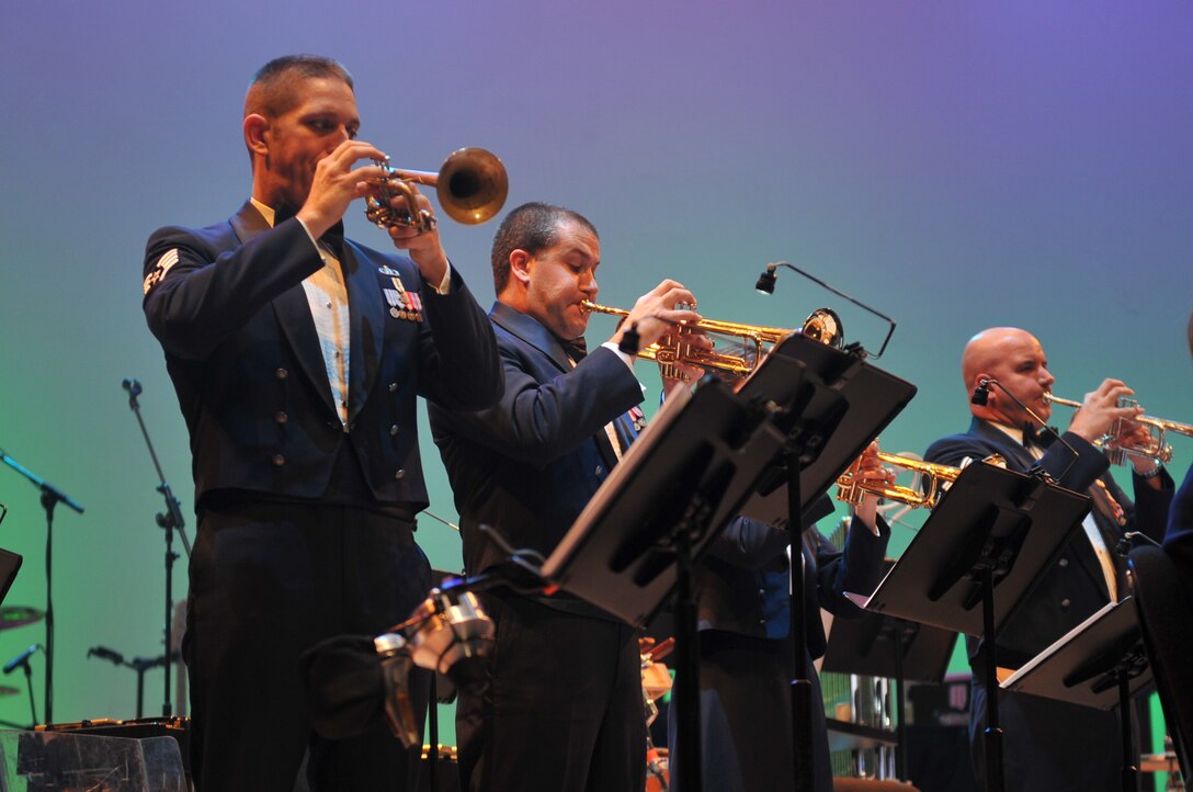 Staff Sergeant Carl Eitzen, Airman First Class Ben Sampson, and Technical Sergeant Eric Proper perform "Overture Battle Royal from 'The Nutcracker'" with Offutt Brass and Heartland Brass