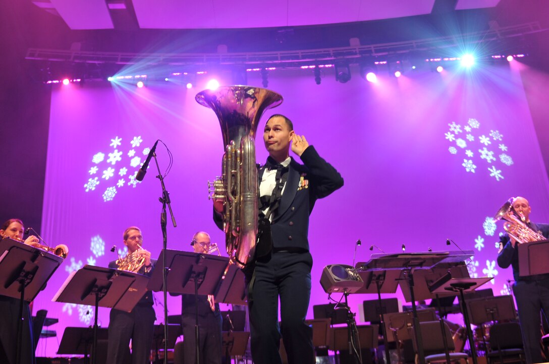 Staff Sergeant George Father works the crowd in "Overture Battle from 'The Nutcracker'" with Heartland Brass and Offutt Brass
