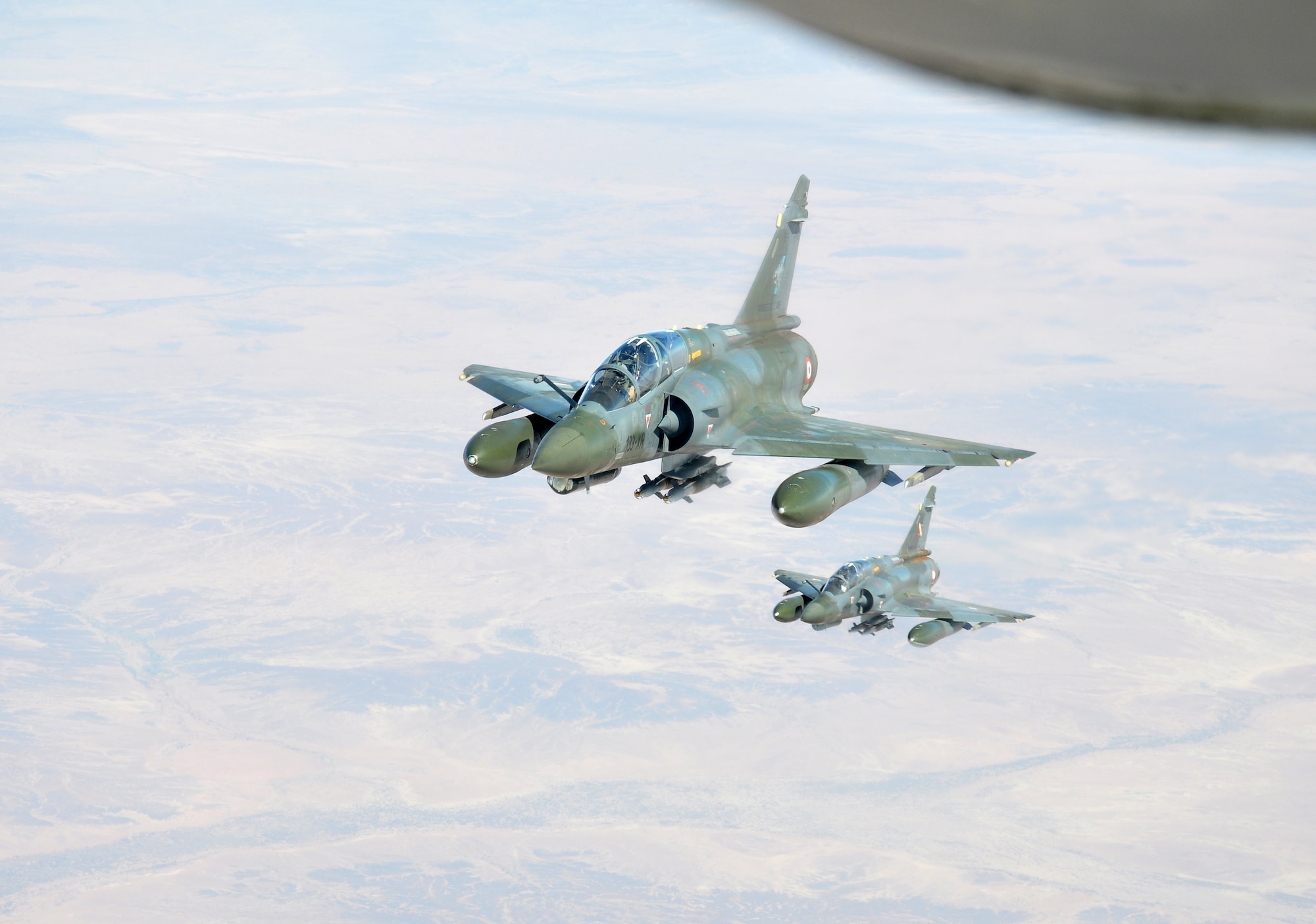 Two French Mirage fighters prepare to refuel from a U.S. Air Force KC-135 Stratotanker from the 100th Air Refueling Wing, RAF Mildenhall, England, over Africa Jan. 29, 2013. Tankers from RAF Mildenhall, operating from a southwest Europe began flying refueling missions in support of French operations in Mali Jan. 27, 2013. (U.S. Air Force photo by Capt. Jason Smith)