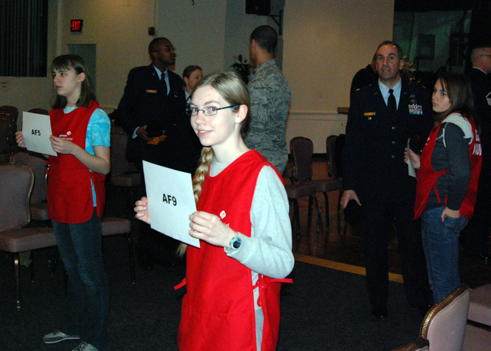 The Girl Scout Council of the Nation's Capital ensured an orderly flow during 57th Presidential Inauguration Day Parade preparation Jan. 21, 2013. The scouts directed Airmen from Joint Base Andrews, Md. to roll call and final instructions prior to boarding buses en route to the parade route. (U.S. Air Force photo/Aletha Frost)