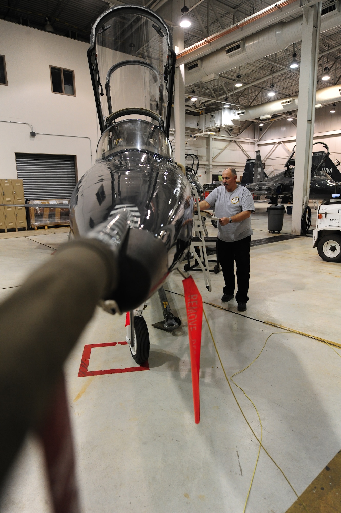 WHITEMAN AIR FORCE BASE, Mo. -- Russ Cass, M1 Support services aircraft mechanic, documents aircraft forms on a T-38 Talon, Jan. 24. Aircraft forms are used to document maintenance being performed, malfunctioning components and aircraft status. (U.S. Air Force photo/Staff Sgt. Nick Wilson) (Released)
