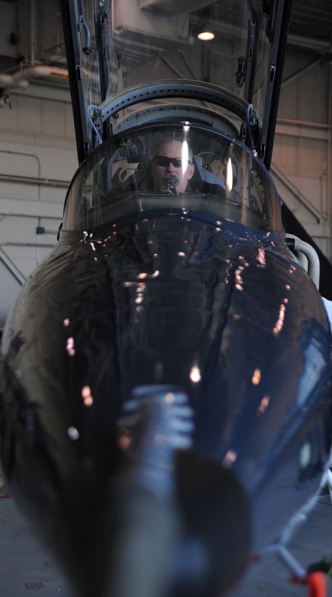 WHITEMAN AIR FORCE BASE, Mo. -- Russ Cass, M1 Support services aircraft mechanic, performs a post-flight inspection on a T-38 Talon, Jan. 23. The post-flight inspection helps aircraft mechanics find malfunctions in various aircraft components that might have occurred during flight. (U.S. Air Force photo/Staff Sgt. Nick Wilson) (Released)