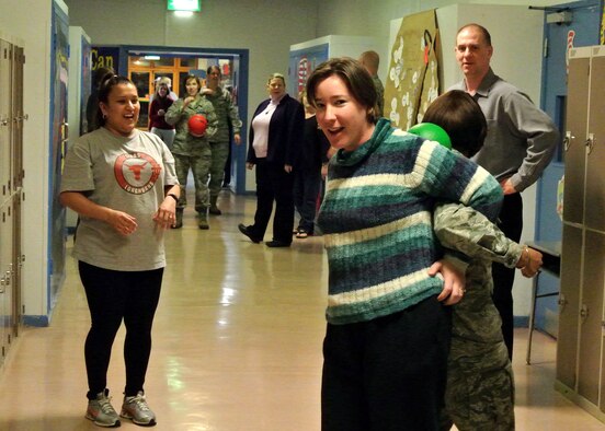 Parents participated in an exercise about how to overcome stressful situations at the Family Links event Jan. 31, 2013, at Lakenheath Intermediate School on RAF Lakenheath, England. The event is specifically designed to help children and parents cope with the challenges of deployments, and was open to any military member or Department of Defense civilian who deploys and has children. More than 30 families attended the event. (U.S. Air Force photo by Tech. Sgt. Stacia Zachary/Released)