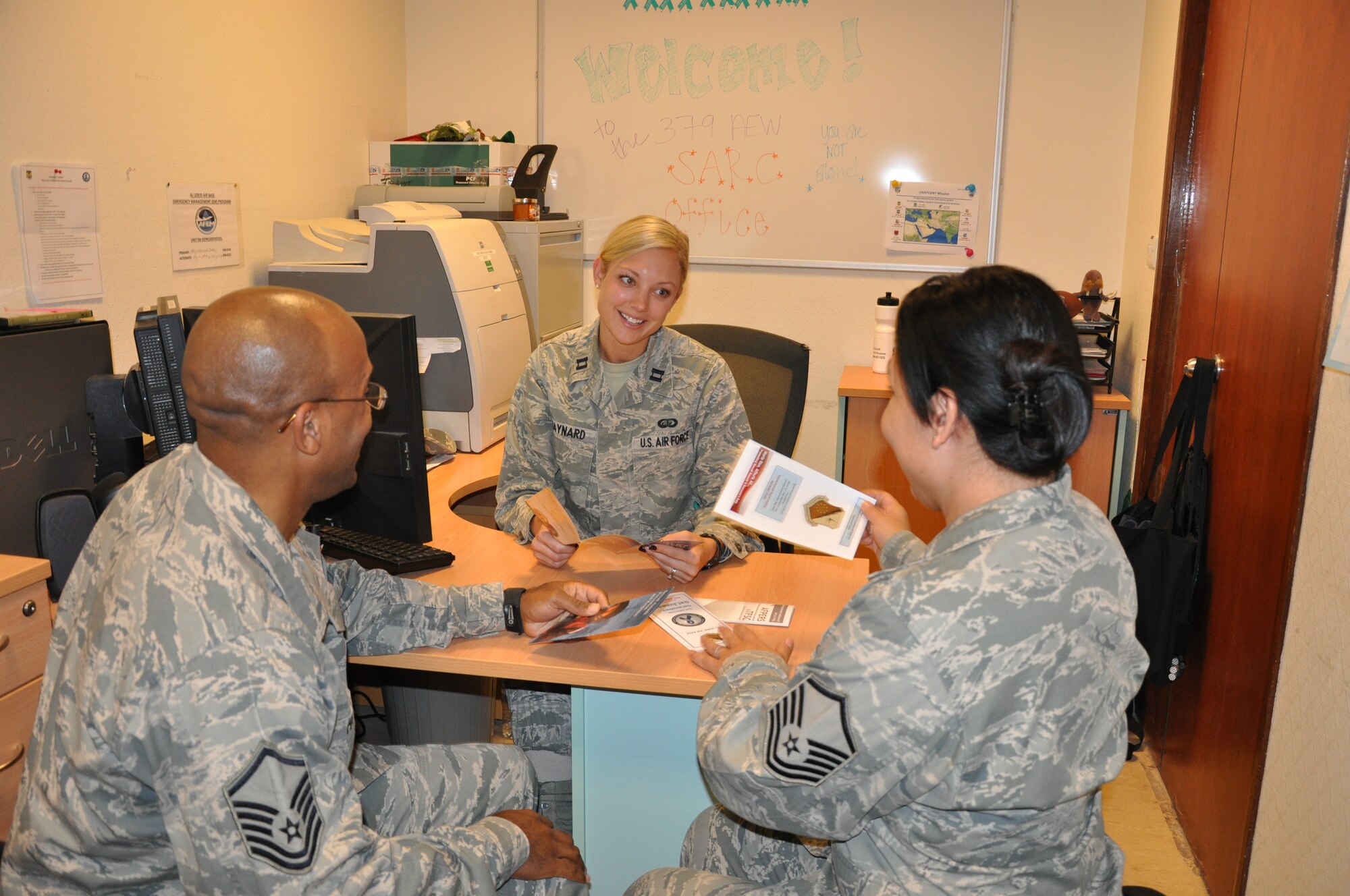 SOUTHWEST ASIA – Master Sgt. Clyde Hardy, 379th Expeditionary Communications Squadron, and Master Sgt. Nichol Williams, 379th Expeditionary Force Support Squadron, meet with Capt. Whitney Maynard, 379th Air Expeditionary Wing Sexual Assault Response Coordinator,  to discuss how to help better educate the base population about the SARC program. (U.S. Air Force photo/Capt. Angela Webb)