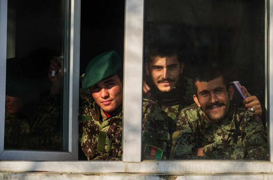 Afghan Air Force Airmen look outside during a break from class at Pohantoon-e-Hawayee, the AAF's “Big Air School,” in Kabul, Afghanistan, Jan. 12, 2013. PeH trains and educates the AAF's future technicians, maintainers and other specialists. (U.S. Air Force photo/Staff Sgt. Jonathan Snyder)