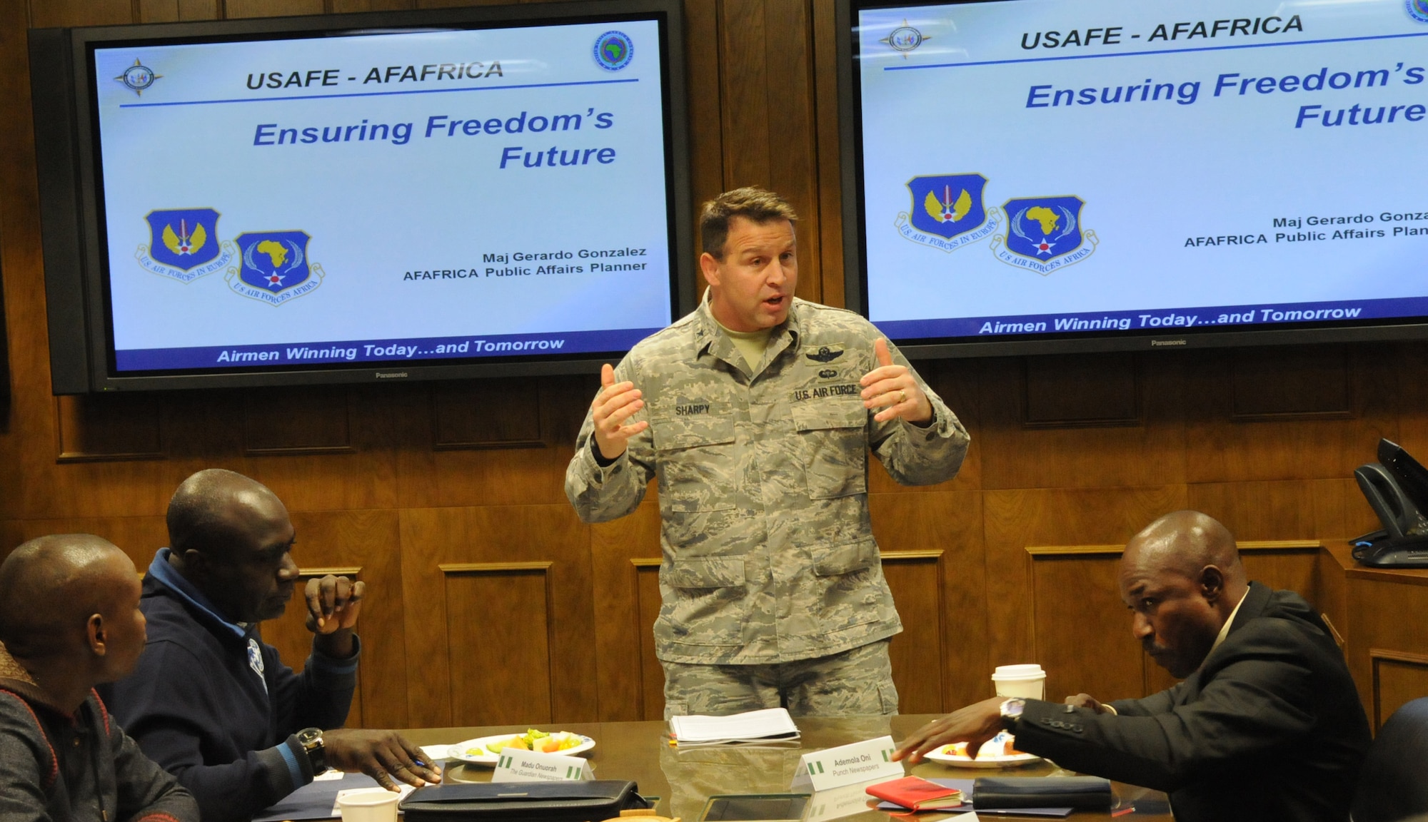 RAMSTEIN AIR BASE, Germany -- Brig. Gen. Thomas J. Sharpy, Director of Plans, Programs and Analyses for United States Air Forces in Europe and Air Forces Africa, welcomes 12 members of the Nigerian media, armed forces and U.S. Embassy, during a visit at Headquarters Air Forces Africa Public Affairs here Jan. 30. The visit was part of U.S. Africa Command's Media Visit Program. U.S. Air Force Photo by Tech. Sgt. James M. Hodgman