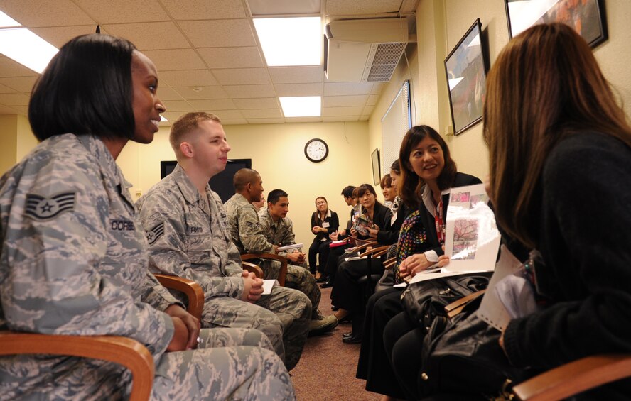 U.S. Air Force Staff Sgts. Josh Foster and Sarah Corbett, 18th Operations Group air traffic controllers, visit with students from the Nikkei College of Business in Okinawa City on Kadena Air Base, Japan, Jan. 30, 2013. The students visited Kadena Air Base as part of a five-day English conversation exchange program and toured the 18th Security Forces Squadron and 18th Maintenance Group facilities. (U.S. Air Force photo/Naoto Anazawa)