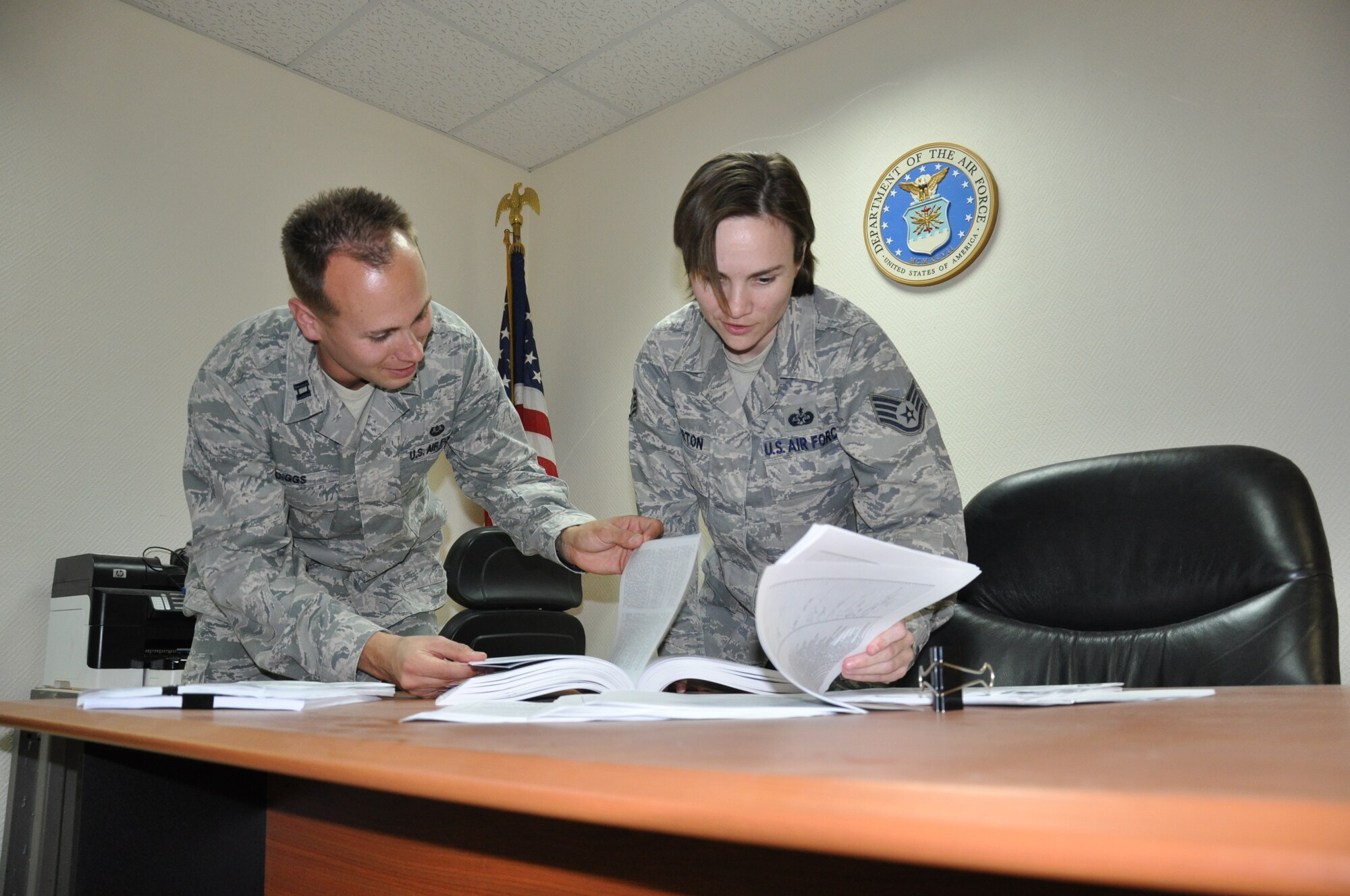 SOUTHWEST ASIA – Capt. Billy Diggs, 379th Air Expeditionary Wing chief of military justice, and Staff Sgt. Amber Morton, 379th AEW NCOIC of military justice, work on a legal review Jan. 24. On average, the military justice section deals with 10 to 15 Article 15s per month. (U.S. Air Force photo/Capt. Angela Webb)