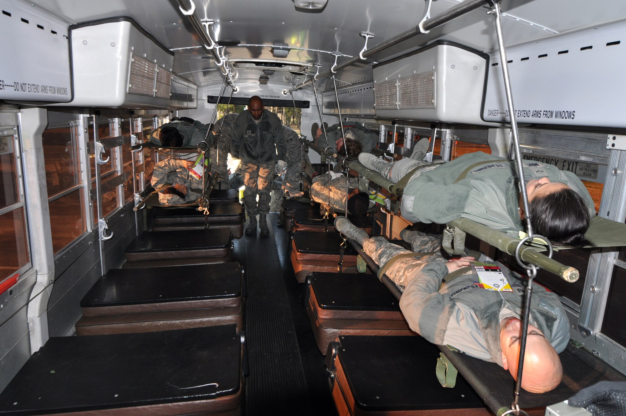 Injured Airmen are being loaded onto an ambus during the mass casualty exercise Jan. 28, 2012 at Joint Base Charleston, S.C. The 315th Aerospace Medicine Squadron conducted the exercise, and more than 145 Airmen from the 315th Airlift Wing participated in the event. Firefighters, civil engineers, members of the clinic, and aeromedical evacuation personnel all played crucial roles in the success of the exercise. (U.S. Air Force photo/Staff Sgt. Shane Ellis)