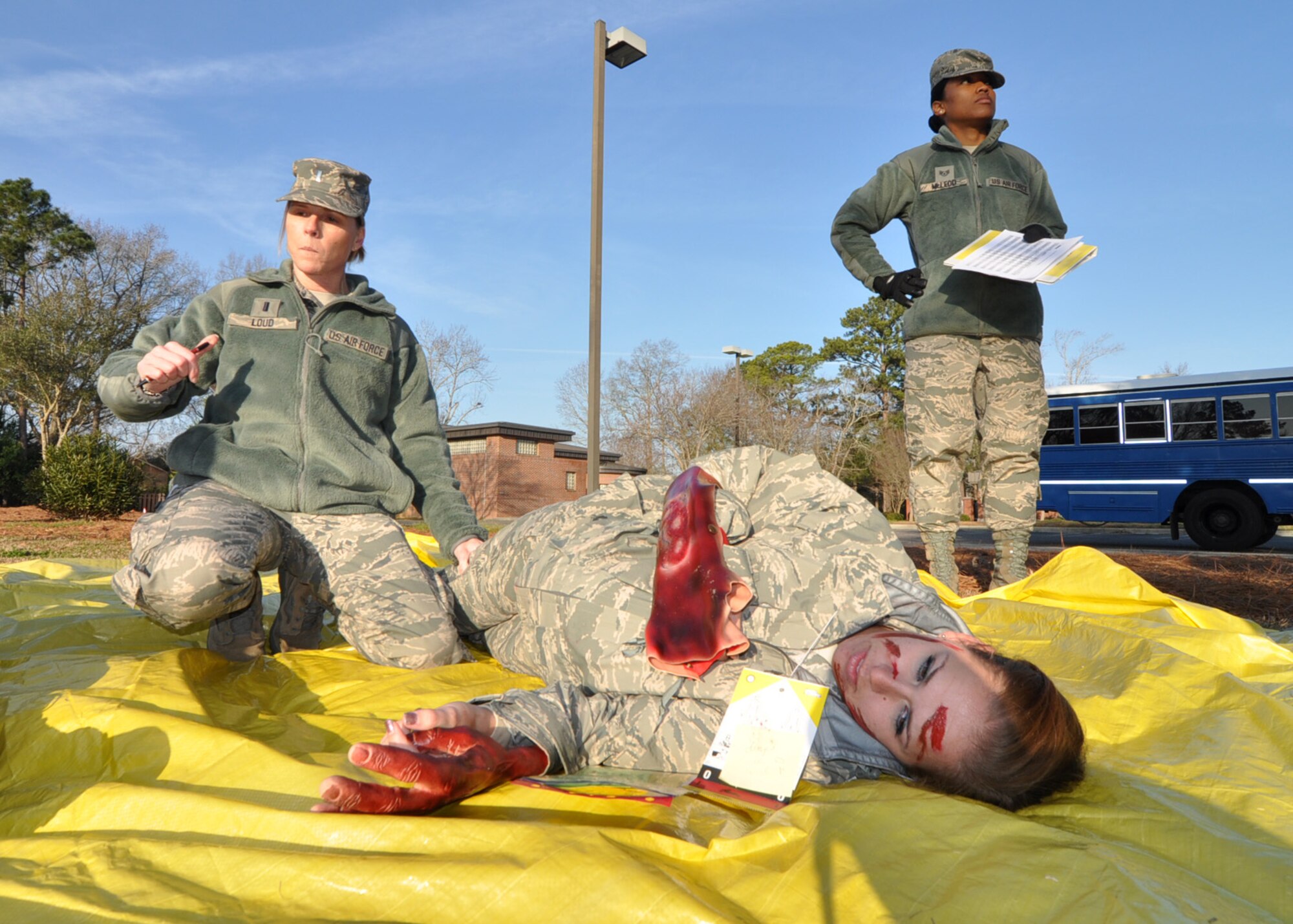 A badly injured Airman is being treated and prepped for transport during the mass casualty exercise Jan. 28, 2012 at Joint Base Charleston, S.C. The 315th Aerospace Medicine Squadron conducted the exercise, and more than 145 Airmen from the 315th Airlift Wing participated in the event. Firefighters, civil engineers, members of the clinic, and aeromedical evacuation personnel all played crucial roles in the success of the exercise. (U.S. Air Force photo/Staff Sgt. Shane Ellis)